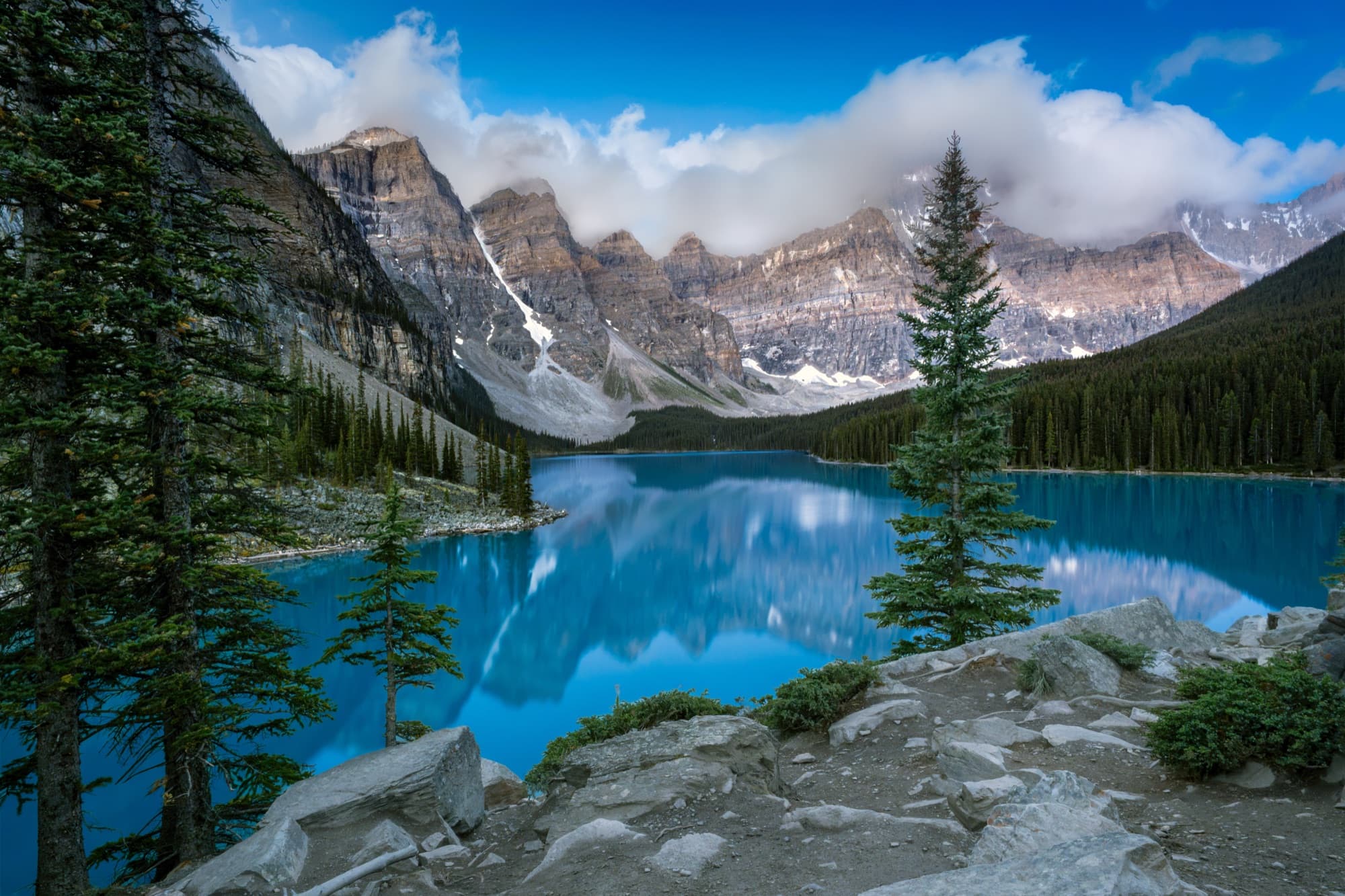 Moraine Lake at dusk, turquoise water beneath alpenglow peaks